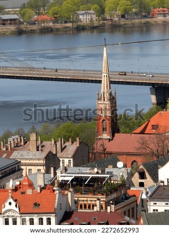 St Saviours Anglican Church by the Daugava river and Vansu bridge in Riga, Latvia