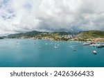 St. Thomas Port: Bustling with small boats and vacationers, a picturesque scene unfolds in the U.S. Virgin Islands, inviting exploration of this charming island paradise