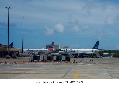 ST. THOMAS, U.S. VIRGIN ISLANDS - APRIL 4, 2022: American Airlines and JetBlue planes on tarmac at the Cyril E. King Airport located at Charlotte Amalie on the island of St. Thomas in the USVI