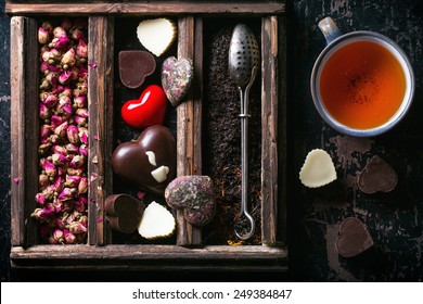 St Valentine Greeting Card With Set Of Dry Tea, Heart From Tea And Chocolate And Cup Of Tea. Top View.