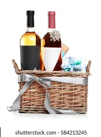 St. Valentines Day Concept. Wine Bottles And Gift Boxes In Basket Isolated On White