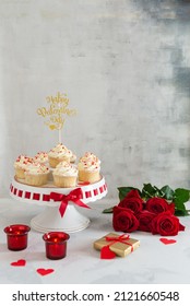 St. Valentine's Day Dessert Recipe. Cupcakes With Small Hearts On Light Background With Red Roses. Romantic Dinner. Greeting Card Design. Happy Valentine's Day. Bakery, Confectionery. Copy Space