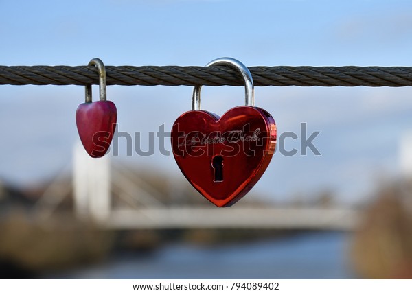 St. Valentine\'s\
Day set. Two padlocks in a heart form: a small and a big one with a\
writing in German \