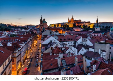St. Vitus Cathedral, Prague Castle and Lesser Town panorama. View of St. Vitus Cathedral, Castle and red roofs. Prague, Czech Republic. View of Prague Castle at sunset. Prague, Czech Republic 