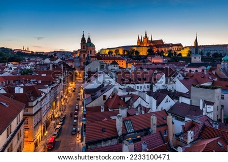 St. Vitus Cathedral, Prague Castle and Lesser Town panorama. View of St. Vitus Cathedral, Castle and red roofs. Prague, Czech Republic. View of Prague Castle at sunset. Prague, Czech Republic 
