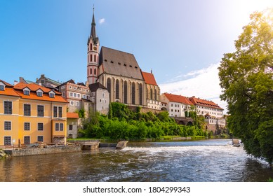 St Vitus church in the middle of historical city centre. View from Vltava River. Cesky Krumlov, Southern Bohemia, Czech Republic.