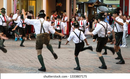 St. Wolfgang Im Salzkammergut, Austria - Jul 13, 2017: Traditional Austrian Folkloric Dancing Performing On Streets With Traditional Clothes Garments Lederhosen And Dirndls.