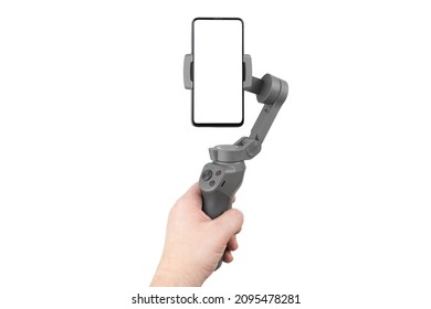 Stabilizer for a smartphone in hand on a white background. Gimbal and smartphone with white screen isolated on white background.