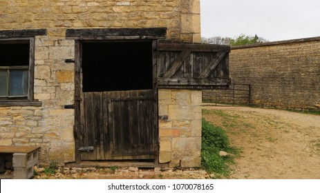 Stable with stable door open on traditional farm yard in Cotswolds, Gloucestershire
