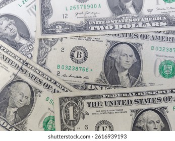 Stack of 1 dollar and 2 dollar US banknotes. One and two dollars. US banknotes. Top view. Flat layout. Business concept.