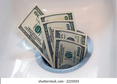 clipart of money going down the drain