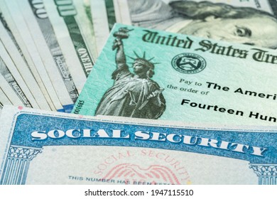 Stack Of 100 Dollar Bills With US Treasury Illustrative Check To Illustrate American Rescue Plan Act Of 2021 Payment With Social Security Card For Retirees