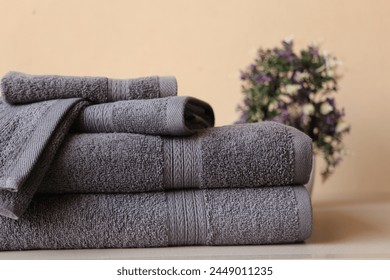 Stack of 2 Gray bath towel with 2 hand towel and 1 wash cloth folded isolated 
