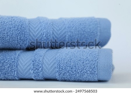 Stack of 2 Sky Blue Bath Towel Arrow Fancy Design Terry Towel isolated with White Background