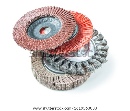 stack of abrasive tools greending flap wheels isolated on white