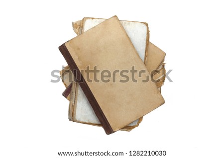 Stack of aged books isolated on a white background.