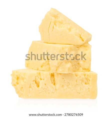 Stack of aged parmesan cheese pieces isolated on white background. Gourmet dairy product close up for culinary and food design.