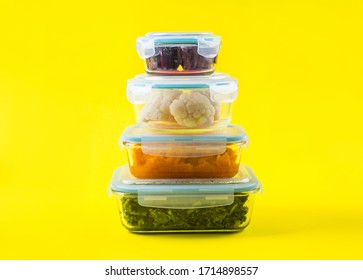 Stack Of Airtight Glass Food Containers With Colorful Cooked Vegetables On Bright Yellow Background. Meal Prep Concept