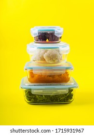 Stack Of Airtight Glass Food Containers With Colorful Cooked Vegetables On Bright Yellow Background. Meal Prep Concept