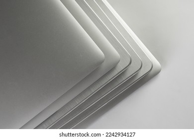 Stack of aluminium laptops top view	