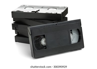 Stack Of Analog Video Home System (VHS) Tape Over White Background