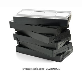 Stack Of Analog Video Home System (VHS) Tape Over White Background