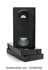 Stack Of Analog Video Home System (VHS) Tape Over White Background