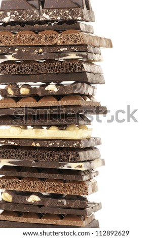 Stack of assorted chocolate on white background..