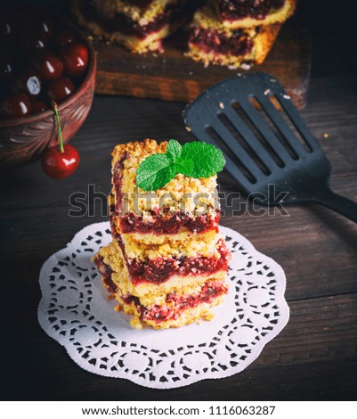 Similar – square pieces of cake crumble with cherry