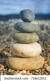 Stack Of Balanced Stones On The Beach