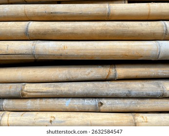 Stack of bamboo poles arranged in parallel. Bamboo poles as background