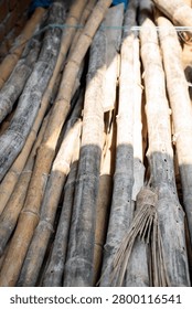 Stack of bamboo poles with natural texture and warm light