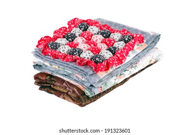 Stack Of Beautiful Handmade Quilts. Isolated On A White Background.