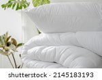 Stack of bedding on the background of the room