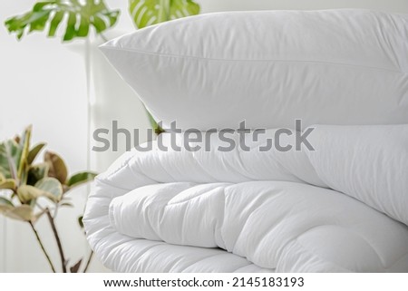 Stack of bedding on the background of the room