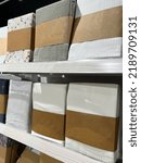 stack of bedding on a shelf in a store