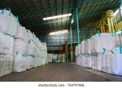 Stack of big bag or jumbo bag containing rice in warehouse, rice mill in thailand