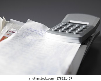 stack of  bill and calculator