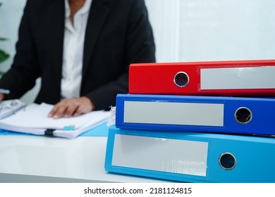 Stack Of Binder File Folder On Table In Business Modern Office.
On Wooden Desk In Large Modern Office 