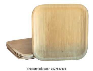 Stack of biodegradable single use plates made from dried palm leaf on white background