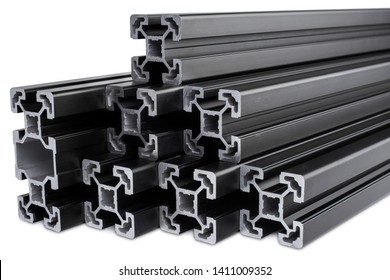 Stack Of Black Anodized Aluminum Extrusion Bars, Isolated On White Background. Construction Metal Steel Factory Concept.