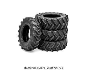 Stack of black tractor tires isolated on white background.