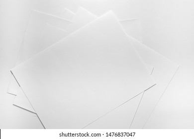 Stack of blank A4 white paper on white board background. Stack of white paper
