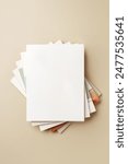 Stack of blank paper on beige background