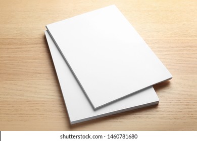 Stack Of Blank Paper Sheets For Brochure On Wooden Background. Mock Up