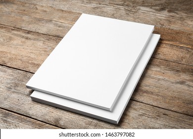 Stack Of Blank Paper Sheets For Brochure On Wooden Background. Mock Up