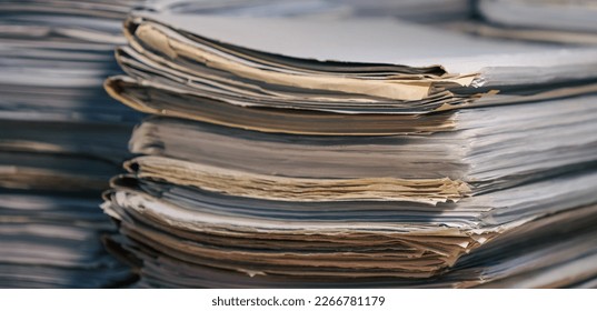 Stack of blank papers with binder clips on wooden table indoors. Workplace. Many documents, contracts, legal agreements, papers on work table. Concept of business, working, job