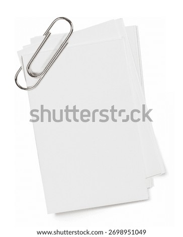 Stack of blank papers with clip. Stack of blank papers with metal paperclip.	