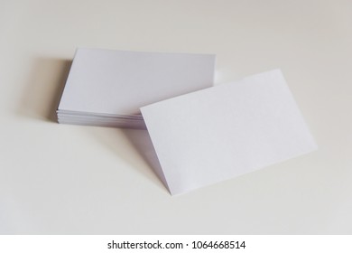 Stack of blank white business cards. Mockup business cards on white background with clipping path - Shutterstock ID 1064668514
