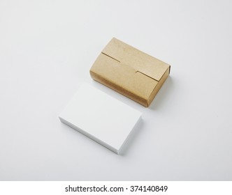 Stack Of Blank White Business Cards And Craft Cards Box On White Background 